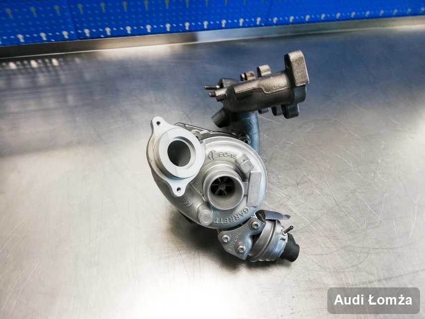 Zregenerowana w firmie w Łomży turbosprężarka do auta spod znaku Audi przygotowana w laboratorium po naprawie przed wysyłką