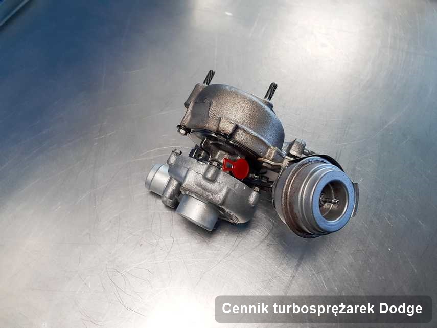 Turbosprężarka do samochodu sygnowane logiem Dodge po remoncie w pracowni gdzie przeprowadza się  usługę Cennik turbosprężarek