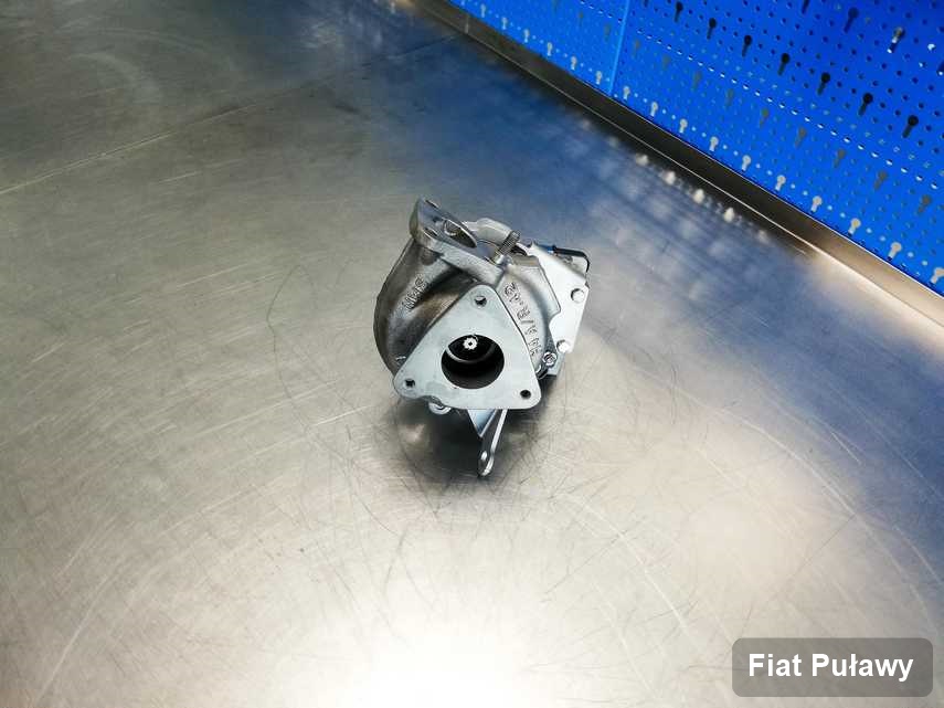Wyczyszczona w pracowni w Puławach turbosprężarka do samochodu koncernu Fiat na stole w laboratorium naprawiona przed spakowaniem
