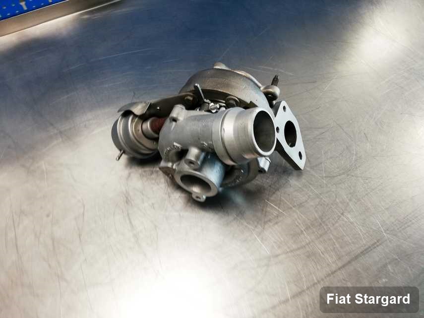 Naprawiona w laboratorium w Stargardzie turbina do auta producenta Fiat na stole w laboratorium naprawiona przed nadaniem