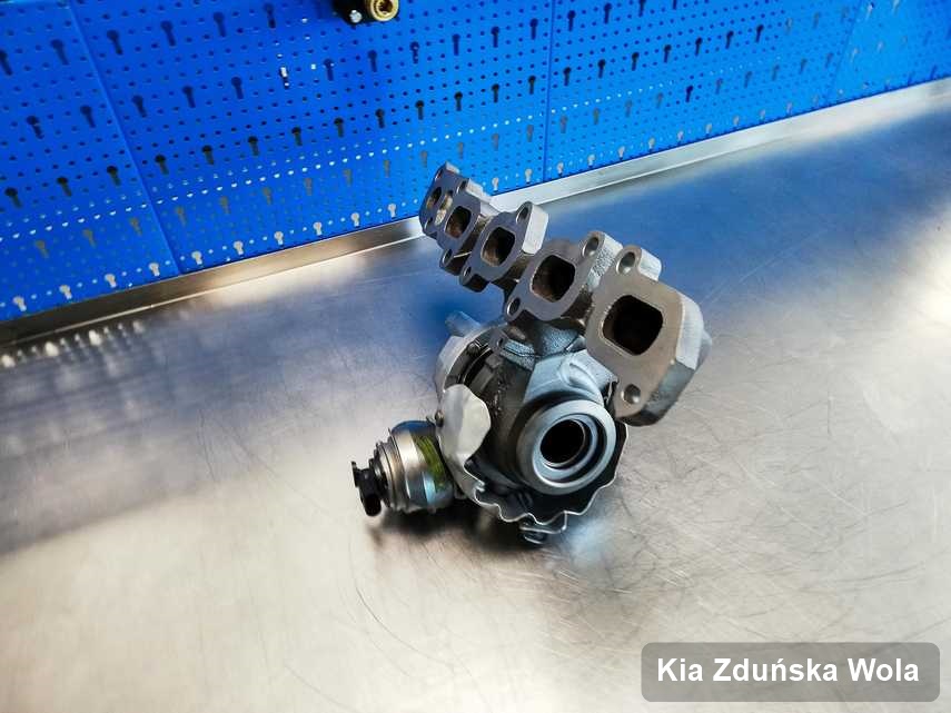 Wyremontowana w pracowni w Zduńskiej Woli turbosprężarka do aut  z logo Kia przyszykowana w warsztacie po naprawie przed spakowaniem