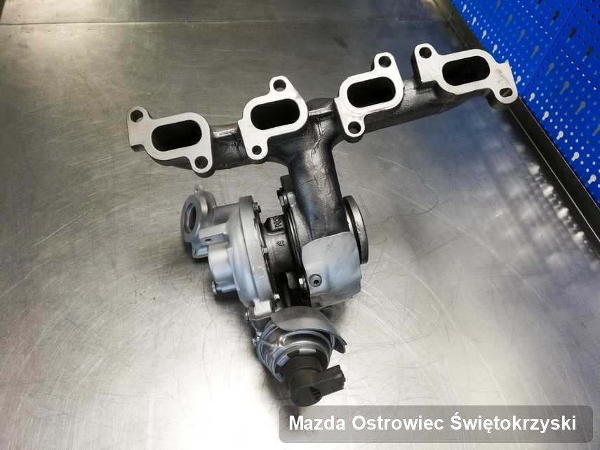 Wyczyszczona w przedsiębiorstwie w Ostrowcu Świętokrzyskim turbosprężarka do aut  koncernu Mazda przyszykowana w warsztacie po naprawie przed nadaniem