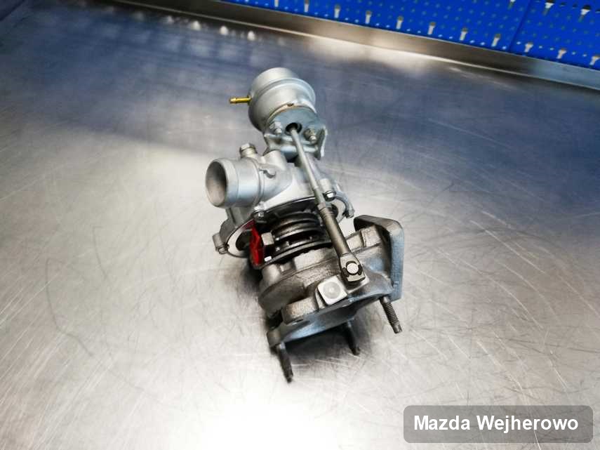 Zregenerowana w laboratorium w Wejherowie turbina do samochodu koncernu Mazda na stole w warsztacie zregenerowana przed nadaniem