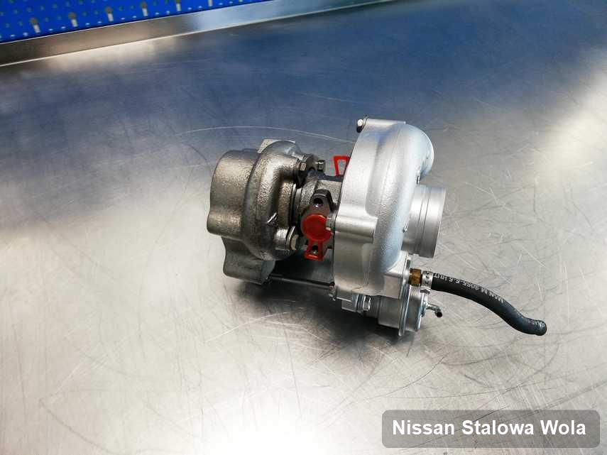 Naprawiona w laboratorium w Stalowej Woli turbosprężarka do auta koncernu Nissan na stole w laboratorium naprawiona przed wysyłką