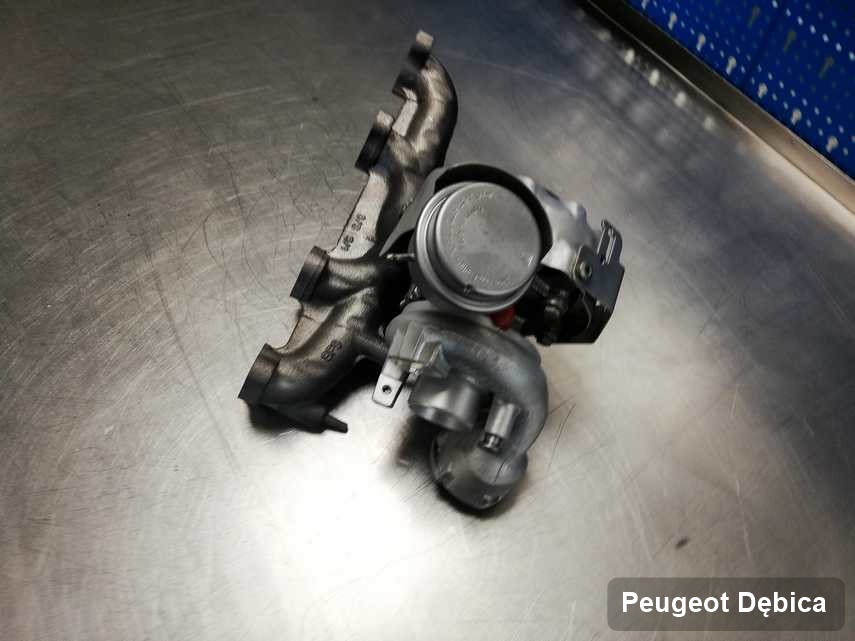 Wyczyszczona w pracowni regeneracji w Dębicy turbosprężarka do aut  firmy Peugeot przygotowana w laboratorium po regeneracji przed spakowaniem