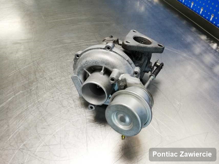 Wyczyszczona w pracowni regeneracji w Zawierciu turbosprężarka do auta marki Pontiac przyszykowana w laboratorium naprawiona przed wysyłką