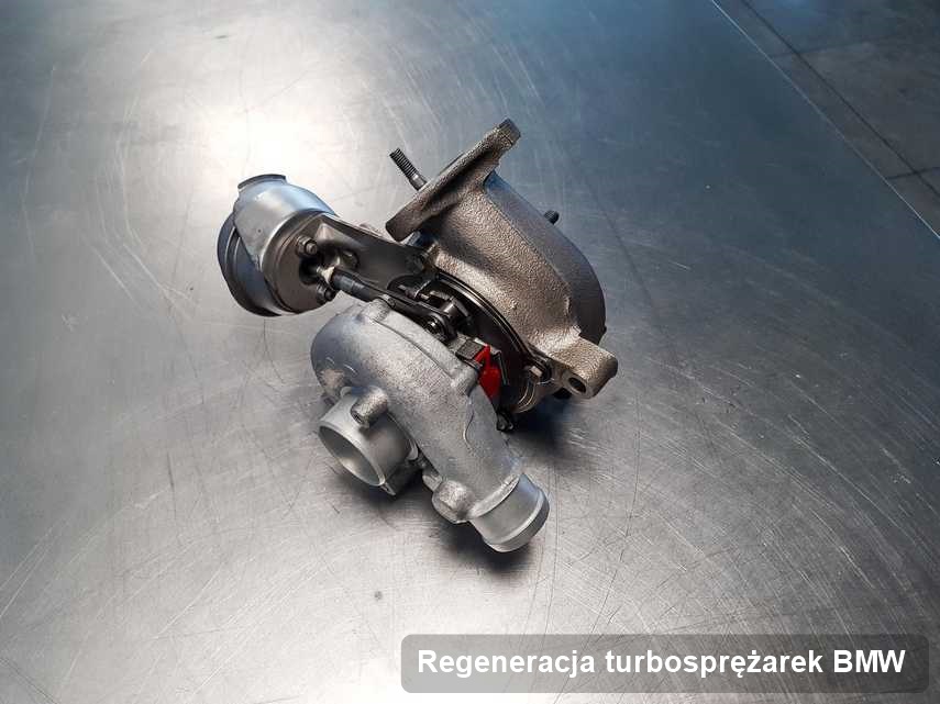 Turbosprężarka do osobówki sygnowane logiem BMW zregenerowana w przedsiębiorstwie gdzie wykonuje się usługę Regeneracja turbosprężarek